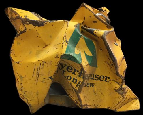 A crumpled door of an old Weyerhauser work truck that was mangled in the  1980 eruption of Mount St. Helens.
